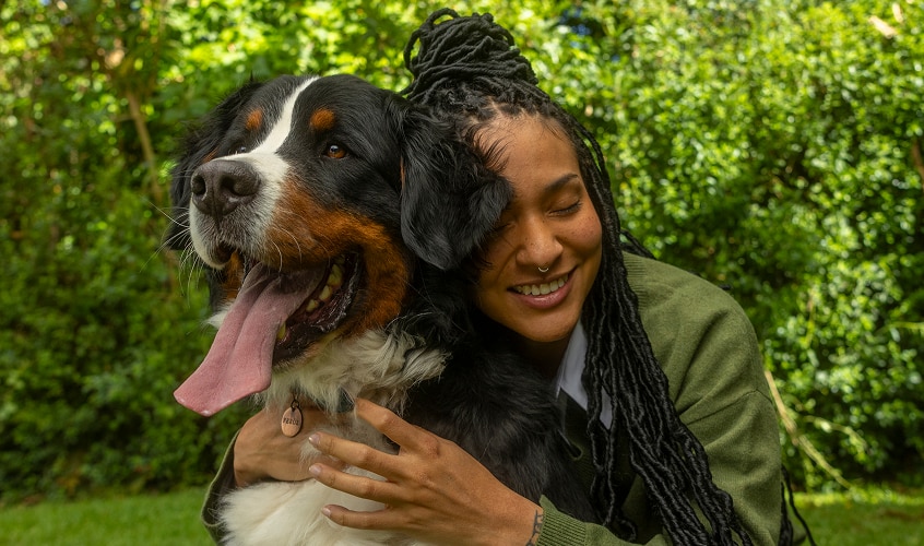 Girl hugging a dog