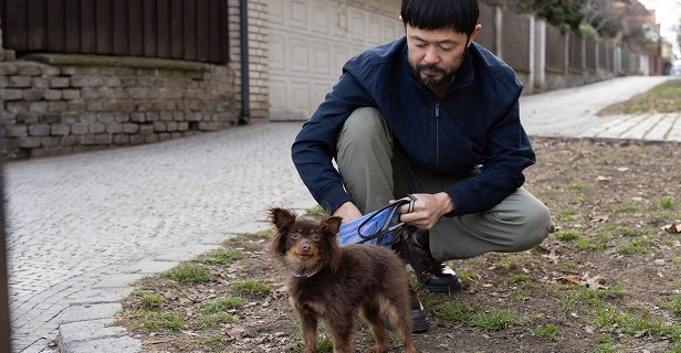 Man holding his chihuahua