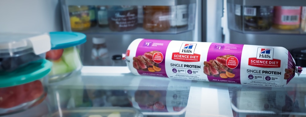 A roll of Hill's Science Diet Single Protein fresh dog food stored inside a refrigerator