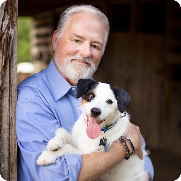 Jim Tedford holding a dog